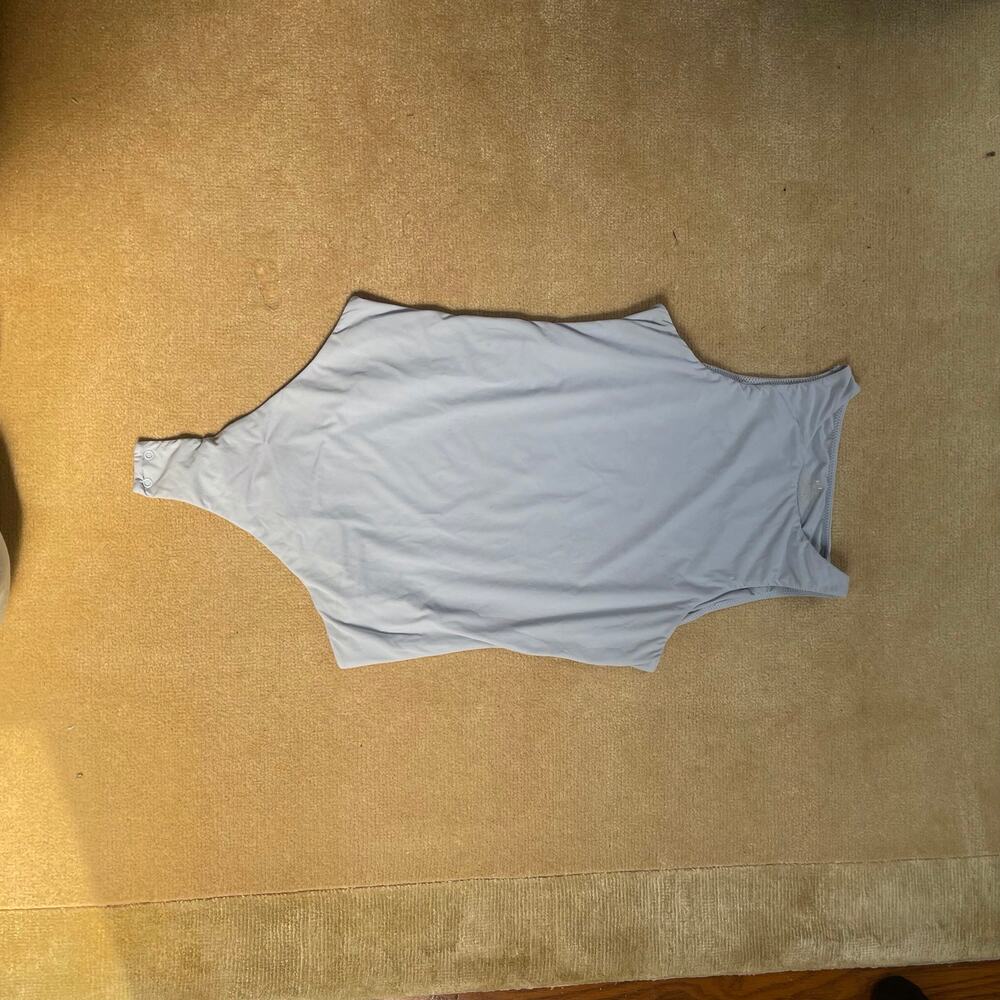 Skims high neck blue body suit
